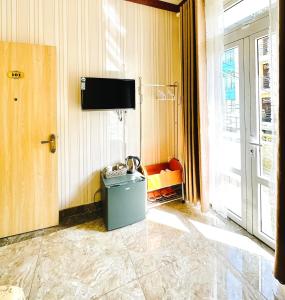 TV a/nebo společenská místnost v ubytování Xing City Hotel Dalat
