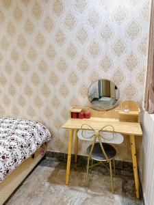 Postel nebo postele na pokoji v ubytování Xing City Hotel Dalat