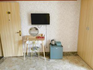 TV a/nebo společenská místnost v ubytování Xing City Hotel Dalat