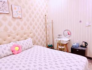 Postel nebo postele na pokoji v ubytování Xing City Hotel Dalat