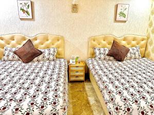 Postel nebo postele na pokoji v ubytování Xing City Hotel Dalat