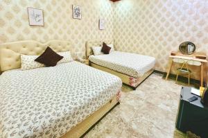 Postel nebo postele na pokoji v ubytování Xing City Hotel Dalat