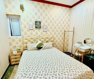 Postel nebo postele na pokoji v ubytování Xing City Hotel Dalat