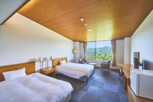Rúm í herbergi á Shiki Resort Hakone Style