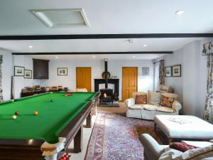 a living room with a pool table in it at The Cow Shed in Quatford