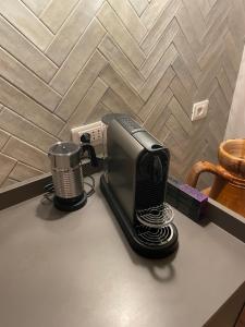 a toaster sitting on top of a counter next to a toasterrences at Borgogna 14 in Reggio Emilia