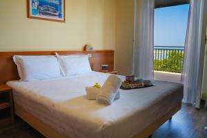 Posteľ alebo postele v izbe v ubytovaní Hotel Regent + 37 fotografií