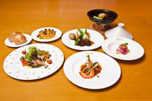 a group of plates of food on a table at Shiki Resort Ventvert Karuizawa in Karuizawa