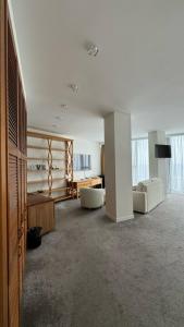 a large room with two white chairs and a table at Boutique Hotel Portofino in Odesa