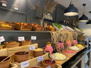 a buffet with many different types of food on display at Sunak Cave Hotel in Urgup