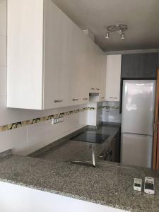 a kitchen with a sink and a refrigerator at 3 bedrooms house with wifi at Cartagena in Cartagena