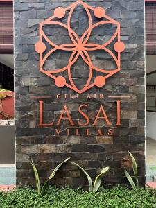 una señal para la entrada a la ciudad de los pueblos lasatales en Lasai Villas, en Gili Air