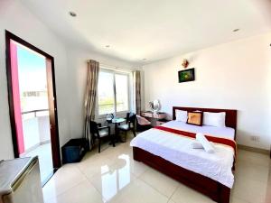 Postel nebo postele na pokoji v ubytování Đức Anh HoTel Vũng Tàu