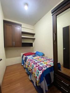 a small room with a bed in a room at Apartement 2BR The Edge Baros by Sky in Cimindi-hilir