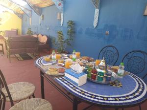 a table with a tray of food on it at Riad Dar Doura in Rabat