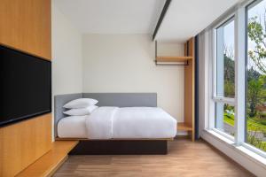 Ein Bett oder Betten in einem Zimmer der Unterkunft Fairfield by Marriott Hangzhou Qiandao Lake