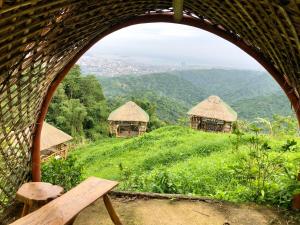 a view of a group of huts on a hill at Aguanga Cabin at Threesome Cafe in Cebu City