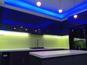 a kitchen with a sink and a blue ceiling at T&T Luxury Hotel in Quy Nhon