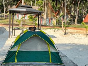 a tent sitting on the ground in a park at Koh RhongSunshine Resort in Phumĭ Kaôh Rŏng
