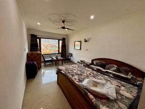 a bedroom with a bed in a room at Hotel Crescent in Srinagar