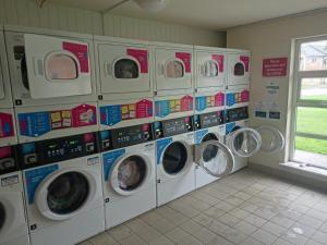 a bunch of washing machines in a laundry room at Student Village 5 minutes from limerick city centre in Limerick