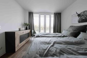 a bedroom with a large bed and a window at Gropius in Dessau