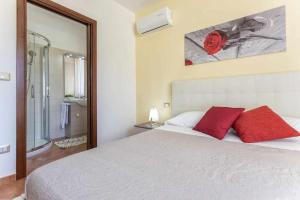 Posteľ alebo postele v izbe v ubytovaní Alghero Villa Mistral per 7 persone Terrazza BBQ AC WiFi
