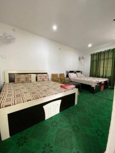 Katil atau katil-katil dalam bilik di HOTEL JAI VASUKI BHADARWAH