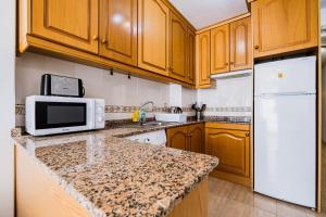 A kitchen or kitchenette at ALEGRIA ID103