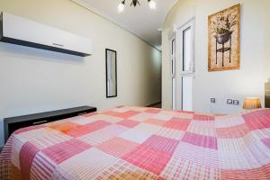 A bed or beds in a room at ALEGRIA ID103