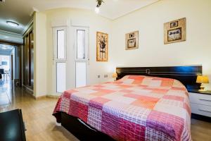 A bed or beds in a room at ALEGRIA ID103