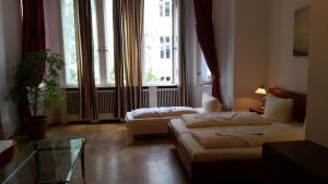 Postel nebo postele na pokoji v ubytování Hotel Pension Kima + 26 fotografií