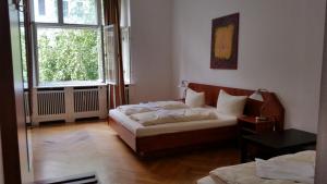 Postel nebo postele na pokoji v ubytování Hotel Pension Kima