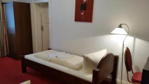 Postel nebo postele na pokoji v ubytování Hotel Pension Kima
