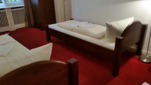 Postel nebo postele na pokoji v ubytování Hotel Pension Kima