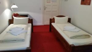Postel nebo postele na pokoji v ubytování Hotel Pension Kima