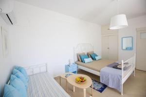 a small bedroom with a bed and a table at The cozy nest:) in Batsi