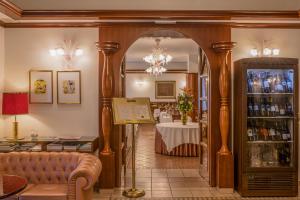 a living room with a couch and a table at Hotel Marko in Portorož