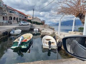 a group of boats parked in the water at Kjara Apartments in Tivat