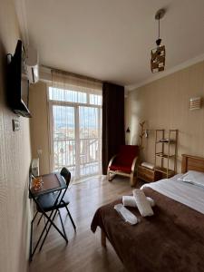 Postel nebo postele na pokoji v ubytování Hotel Marioni
