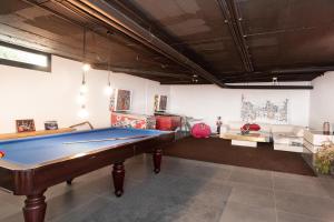 a living room with a pool table in it at Villa Lujo Castelldefels Barcelona in Castelldefels