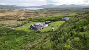an aerial view of a house on a grassy hill at Valentia View in Portmagee