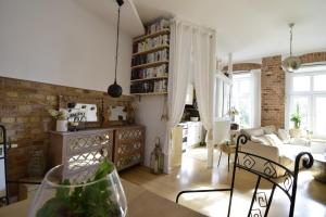 a living room with a couch and a table at Style & Center Spot in Poznań
