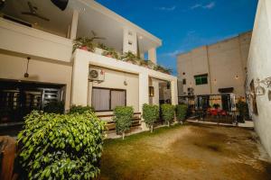 a house with plants on the side of it at VIP House Peshawar in Peshawar