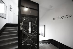 a black elevator door with a map on it at Urban Boutique Hotel Center in Ljubljana