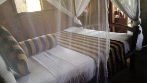 Letto o letti in una camera di Sigiriya Rock Gate Tree House