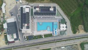 an aerial view of a building with a swimming pool at Sunthalia Hotels & Resorts Ultra All Inclusive Adults Only Party Hotel in Side