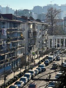 a parking lot full of cars in a city at Апартаменты от Зуры in Batumi