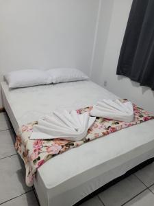 Tempat tidur dalam kamar di Recanto do Sonho