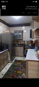 a kitchen with a rug on the floor at شقة in Cairo